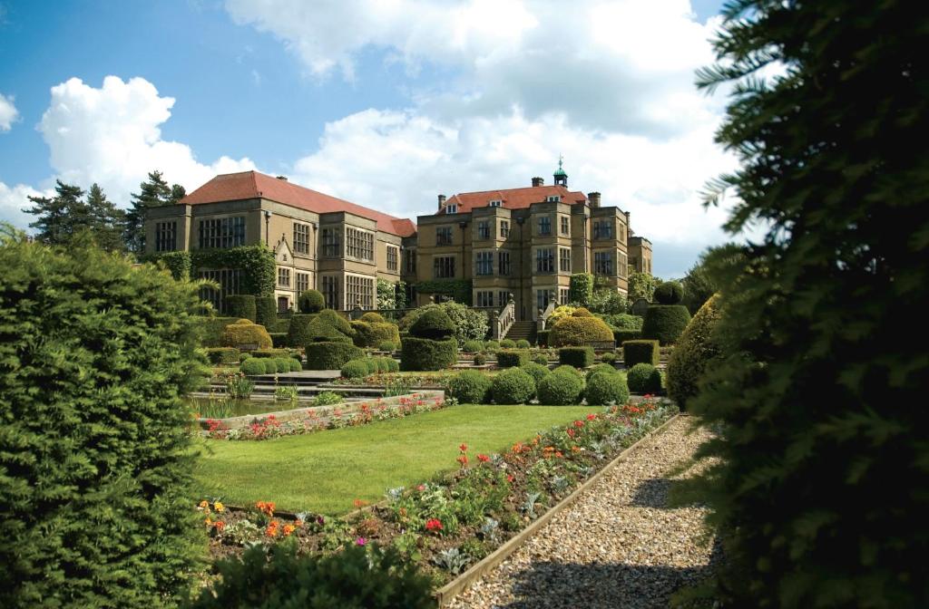 a large building with a garden in front of it at Fanhams Hall, Exclusive Collection in Ware