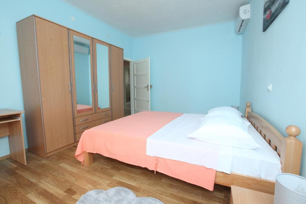 Posteľ alebo postele v izbe v ubytovaní Apartman Seaside Paradise