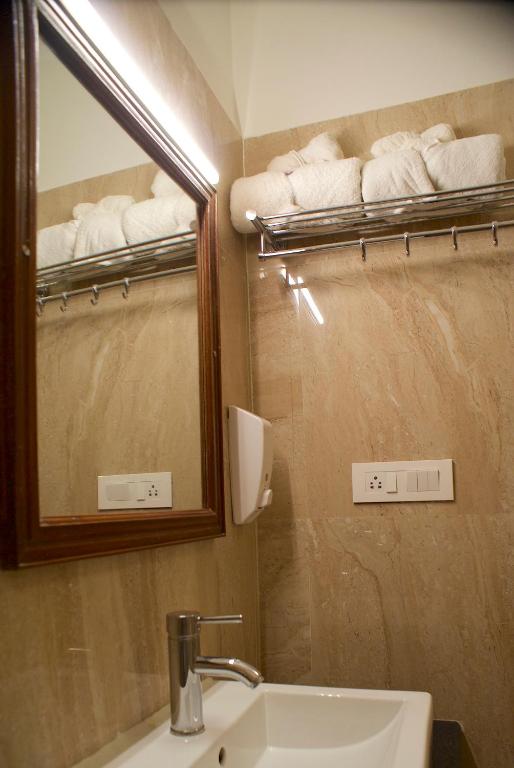 Koupelna v ubytování Hotel Alpana