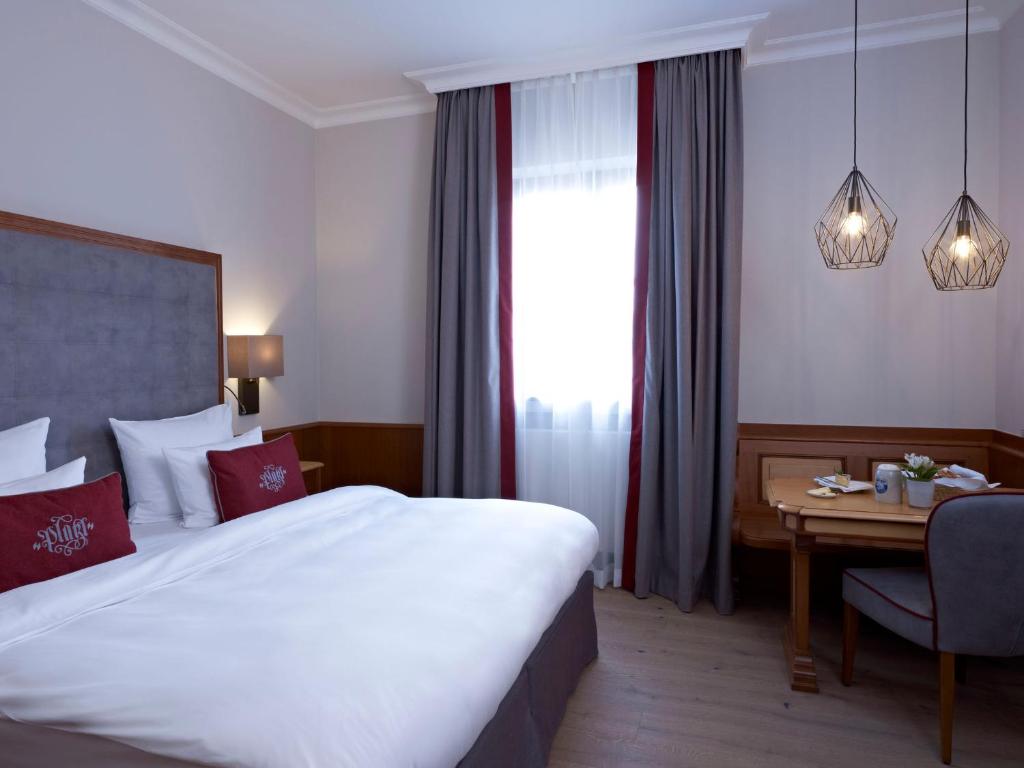Postel nebo postele na pokoji v ubytování Platzl Hotel - Superior