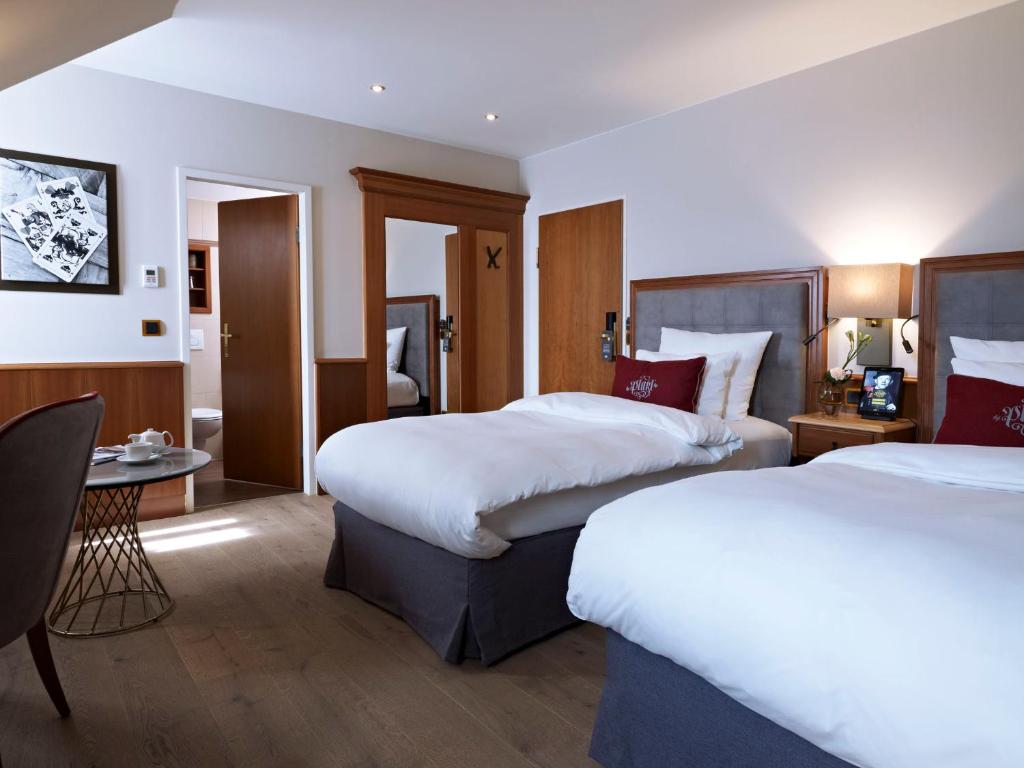 Postel nebo postele na pokoji v ubytování Platzl Hotel - Superior