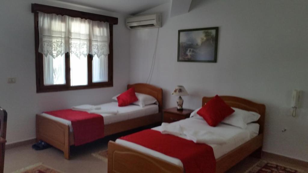 Posteľ alebo postele v izbe v ubytovaní Hotel Berati