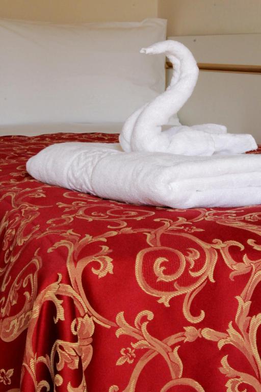 Postel nebo postele na pokoji v ubytování Hotel Clara