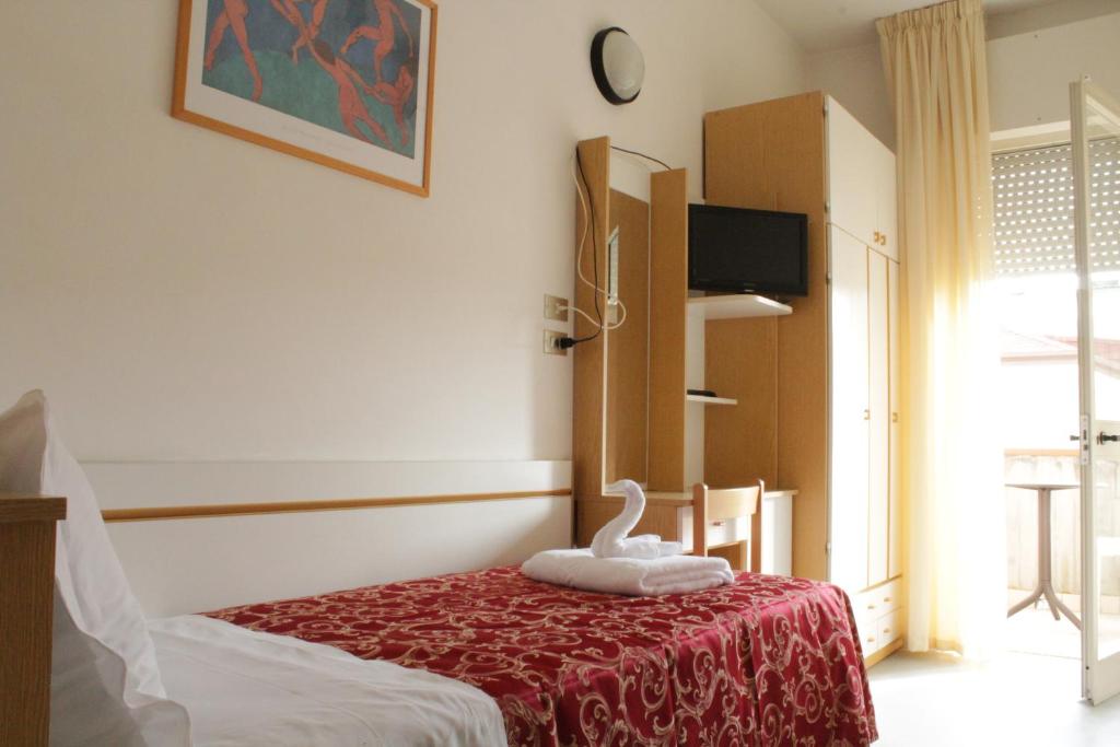 Postel nebo postele na pokoji v ubytování Hotel Clara