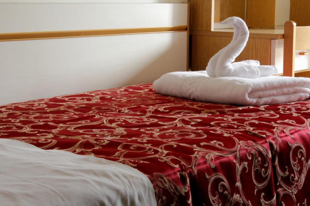 Postel nebo postele na pokoji v ubytování Hotel Clara