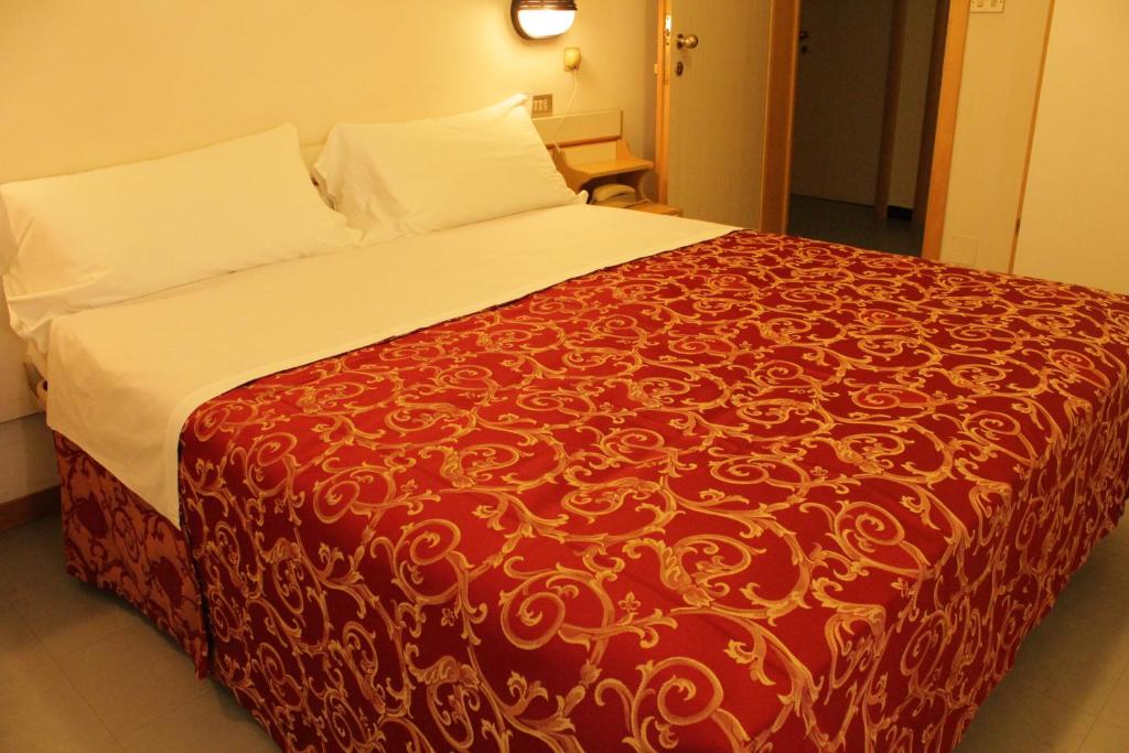Postel nebo postele na pokoji v ubytování Hotel Clara