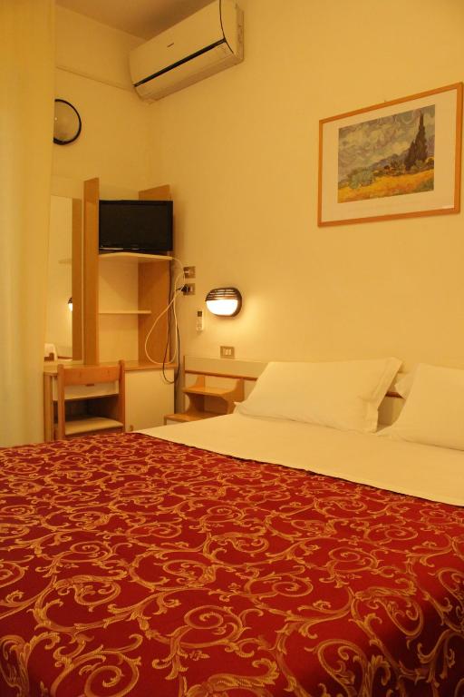 Postel nebo postele na pokoji v ubytování Hotel Clara
