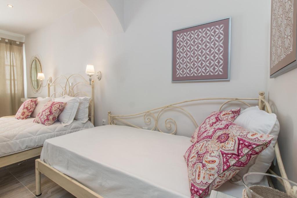 a bedroom with two beds in a room at Relax Studios in Naxos Chora