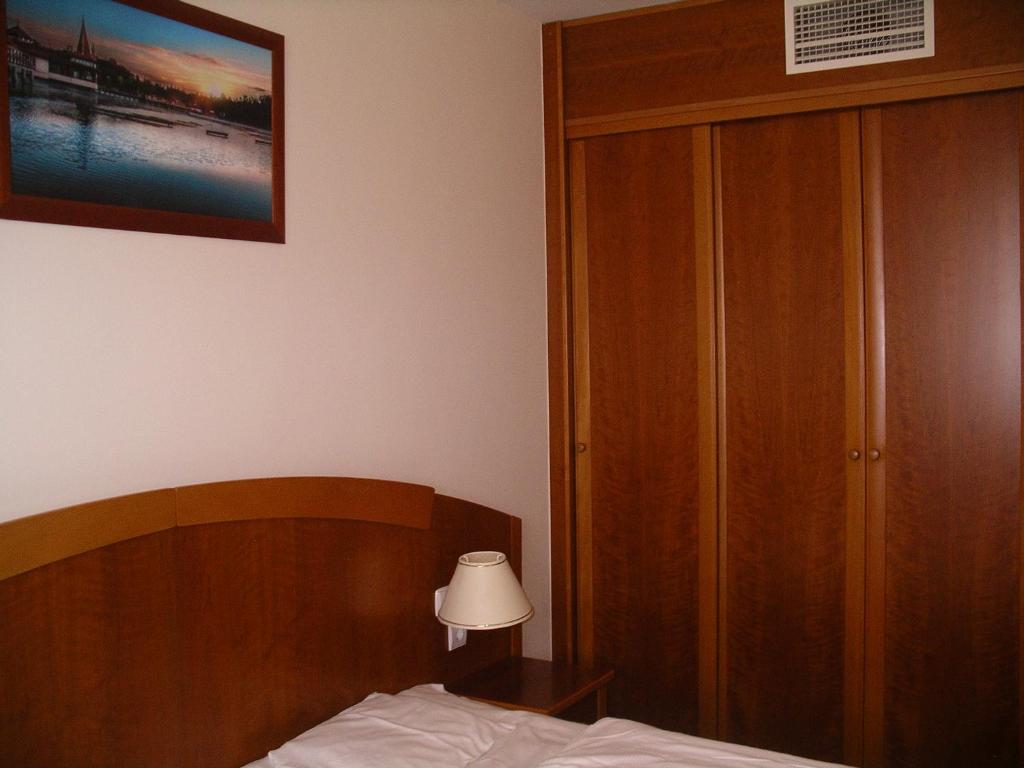 Postel nebo postele na pokoji v ubytování Palast Wellness Appartement