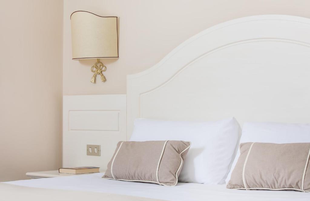 Postel nebo postele na pokoji v ubytování Hotel Ercolini & Savi