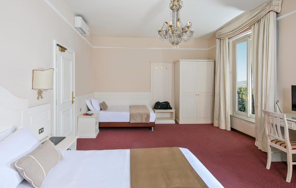 Postel nebo postele na pokoji v ubytování Hotel Ercolini & Savi