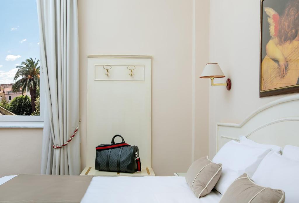 Postel nebo postele na pokoji v ubytování Hotel Ercolini & Savi