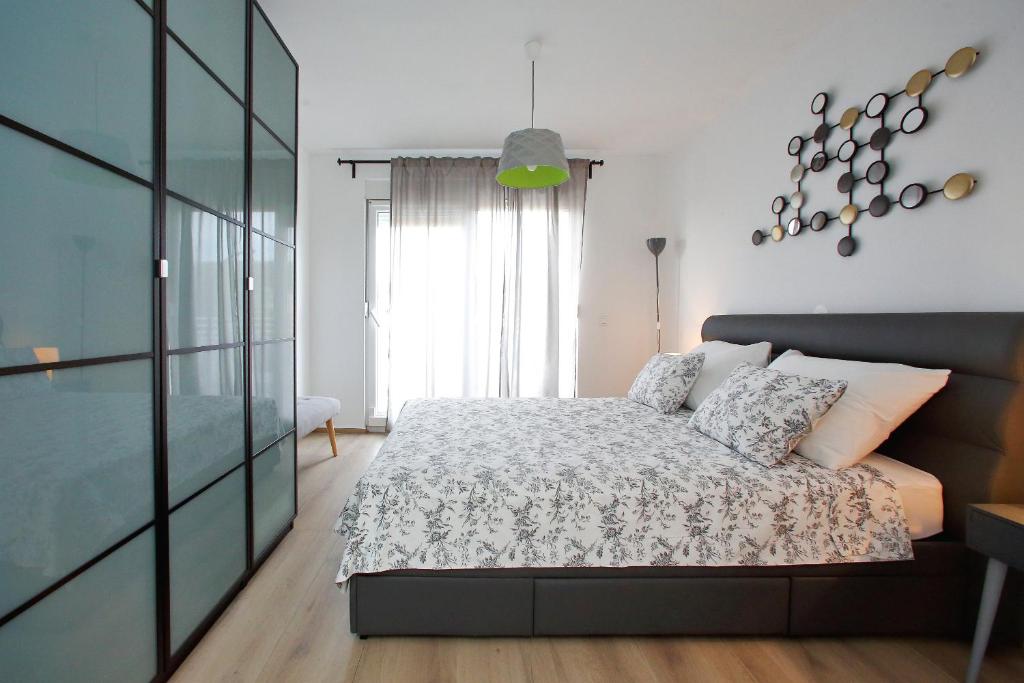 Postel nebo postele na pokoji v ubytování L apartments