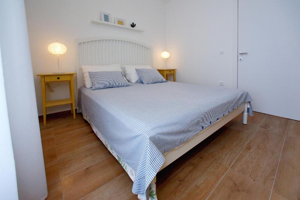 Postel nebo postele na pokoji v ubytování L apartments