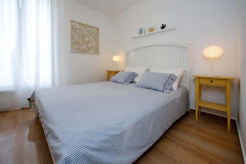 Postel nebo postele na pokoji v ubytování L apartments