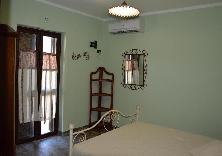 Tempat tidur dalam kamar di Agriturismo Donna Beatrice