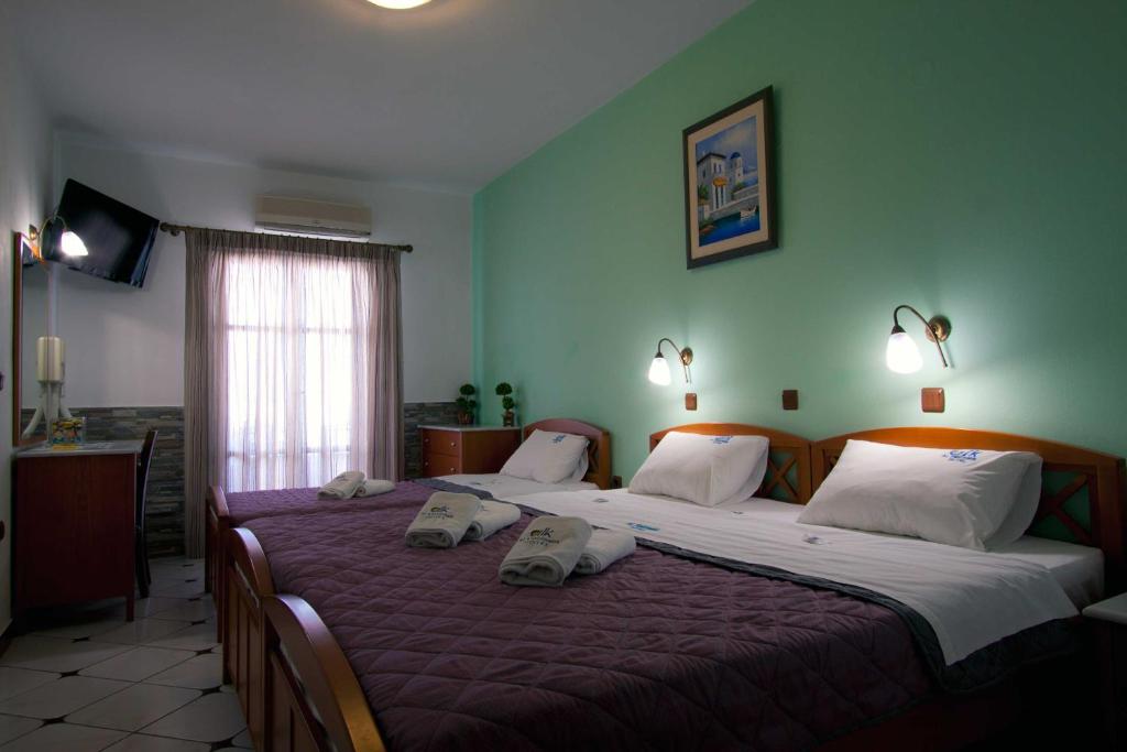 Postel nebo postele na pokoji v ubytování ALK Hotelᵀᴹ