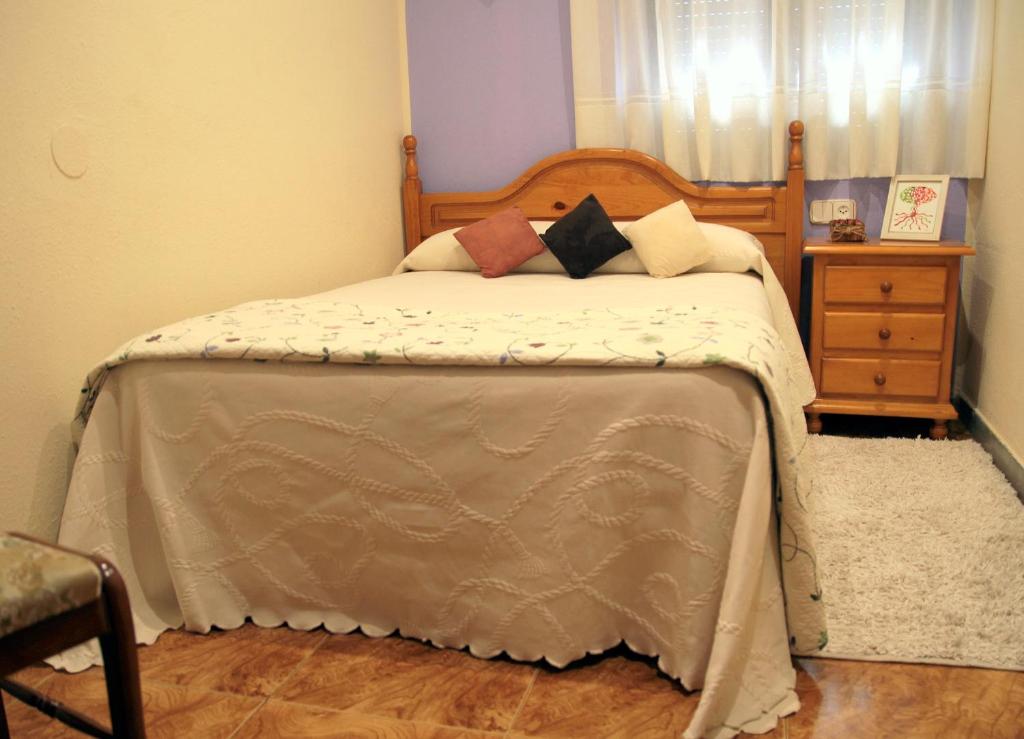 Postel nebo postele na pokoji v ubytování Hostal pachin