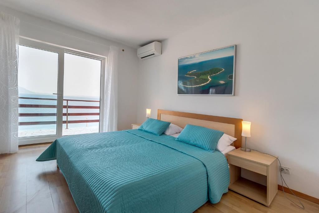 Postel nebo postele na pokoji v ubytování Apartment Marika