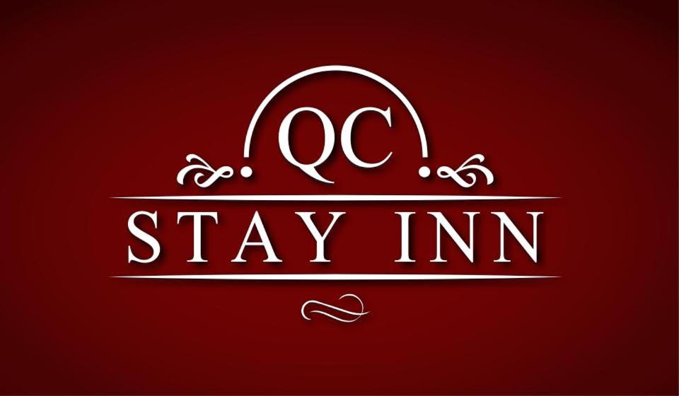 a red sign with the words stay inn at QC Stay Inn in Moline