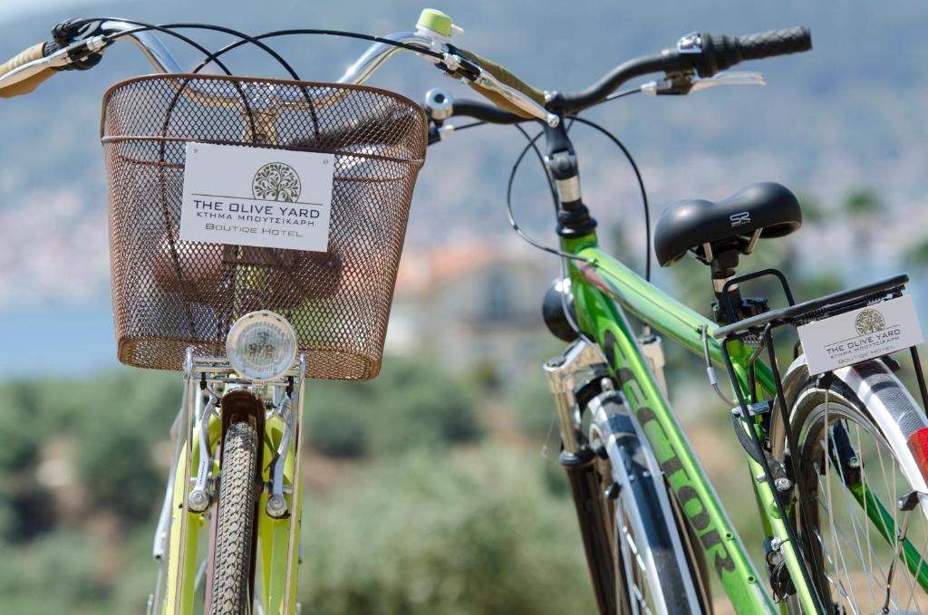 a bicycle with a basket on the front of it at The Olive Yard in Gythio
