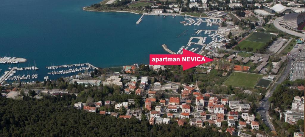 a city with a red sign that reads expedition neyer at Apartment Nevica in Split