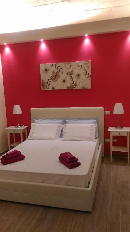Postel nebo postele na pokoji v ubytování B&B Excelsior
