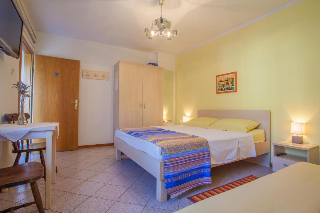 Postel nebo postele na pokoji v ubytování Rooms Ester