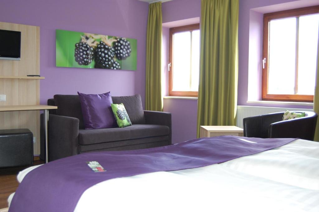 Ein Bett oder Betten in einem Zimmer der Unterkunft Gasthof Linden & Wildkräuterhotel