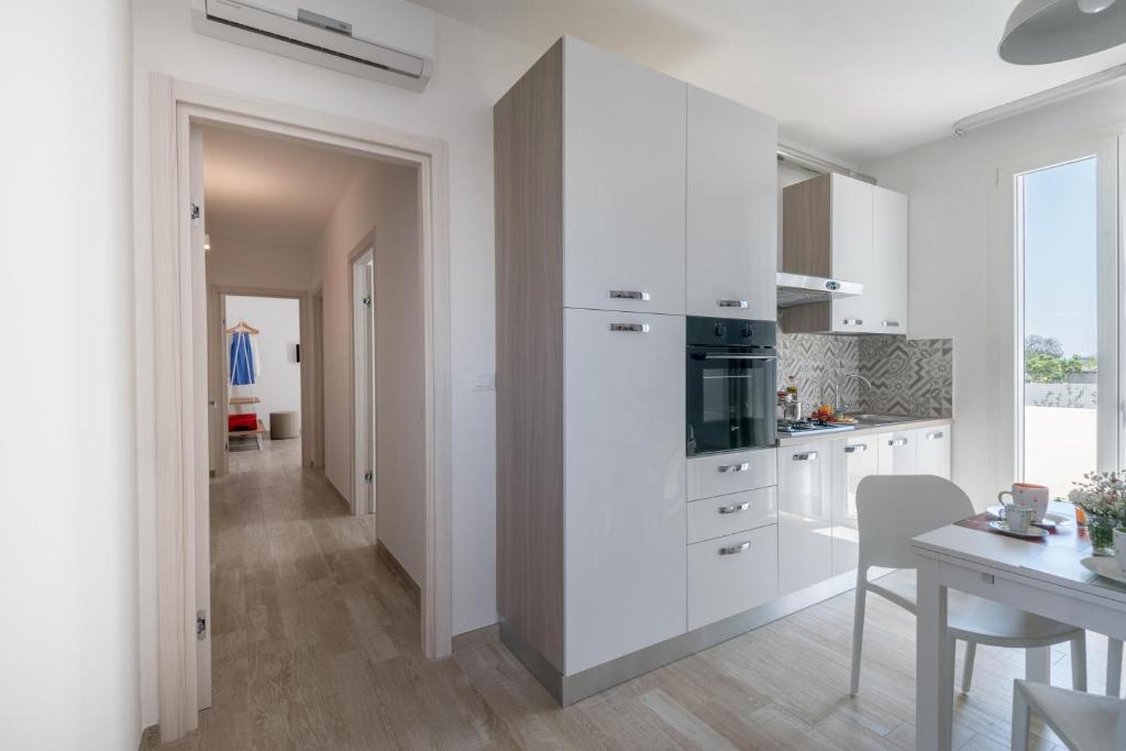 Kuchyň nebo kuchyňský kout v ubytování Calura Residence