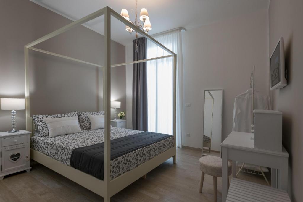 Postel nebo postele na pokoji v ubytování Calura Residence