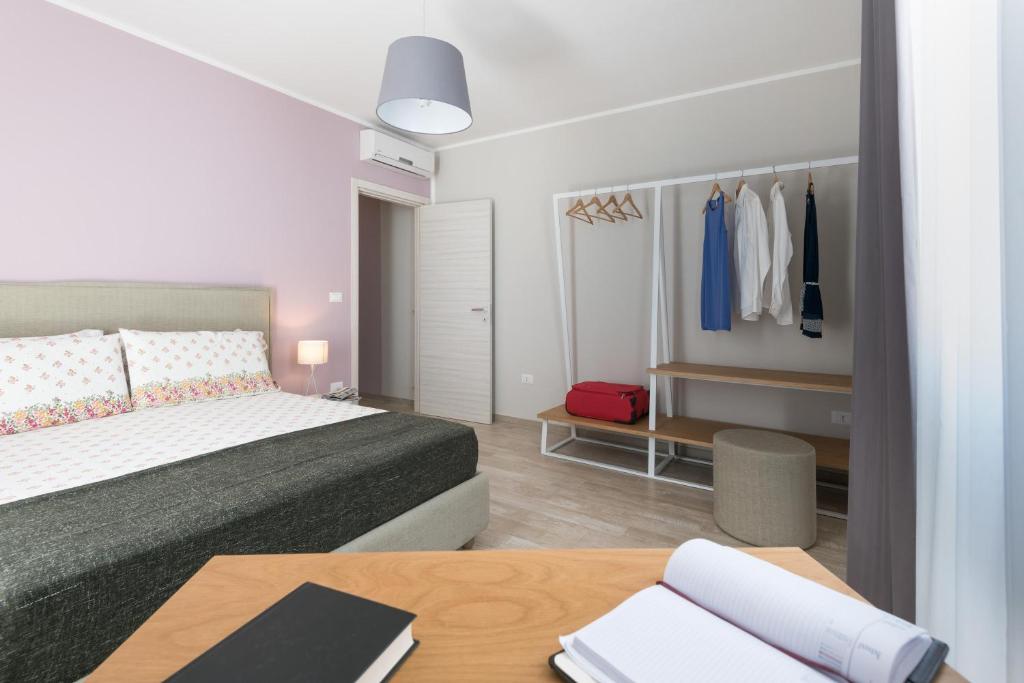 Postel nebo postele na pokoji v ubytování Calura Residence