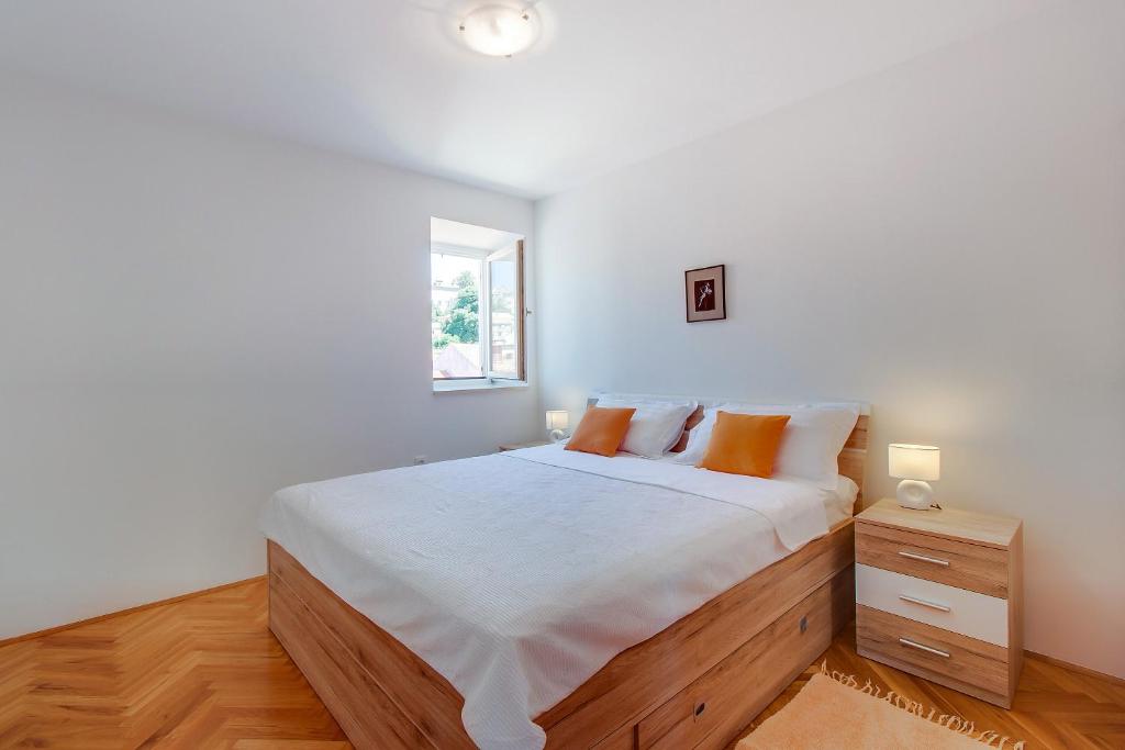 Posteľ alebo postele v izbe v ubytovaní Apartments Bellus Mare