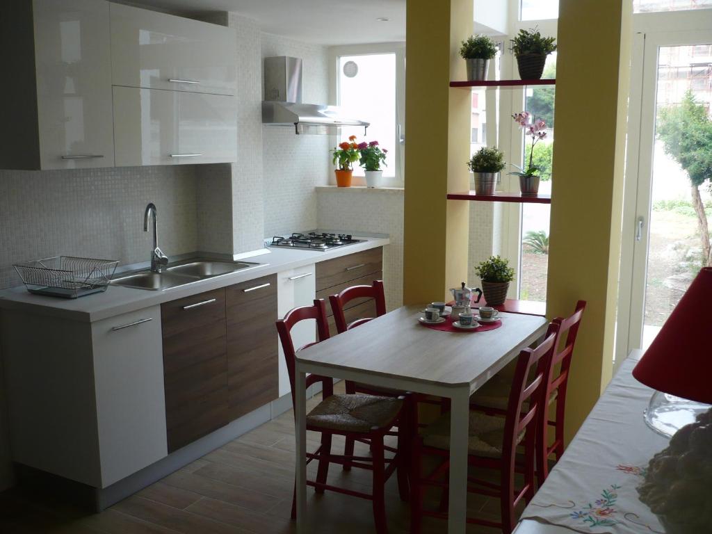 Kuchyň nebo kuchyňský kout v ubytování B&B Excelsior