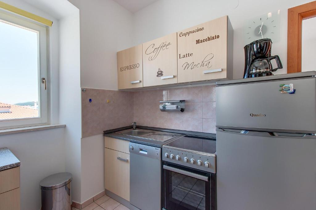 Kuchyňa alebo kuchynka v ubytovaní Apartments Bellus Mare