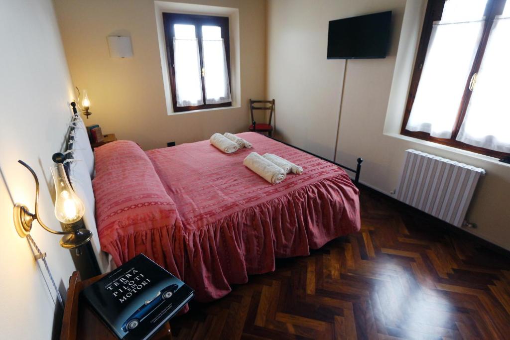 Postel nebo postele na pokoji v ubytování B&B Le Noci di Feo
