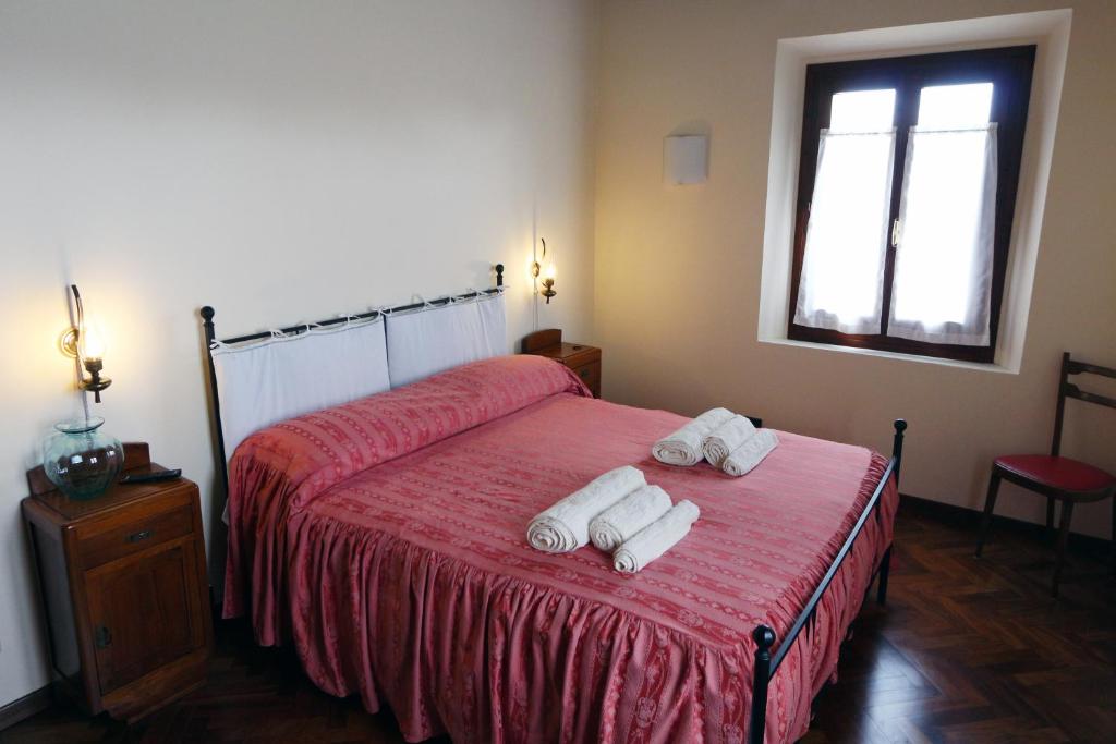 Postel nebo postele na pokoji v ubytování B&B Le Noci di Feo