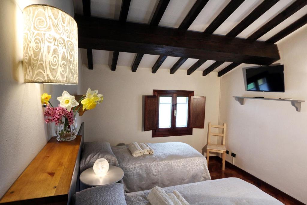 Postel nebo postele na pokoji v ubytování B&B Le Noci di Feo