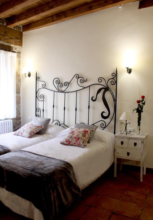 Postel nebo postele na pokoji v ubytování Posada Rural La Piñorra