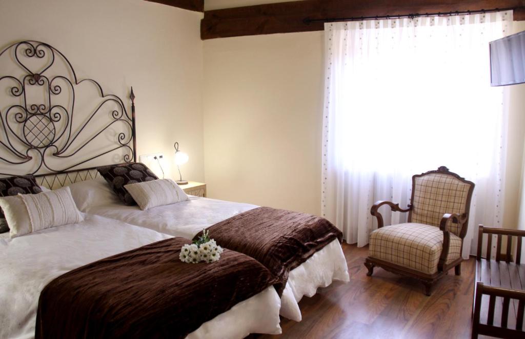 Postel nebo postele na pokoji v ubytování Posada Rural La Piñorra
