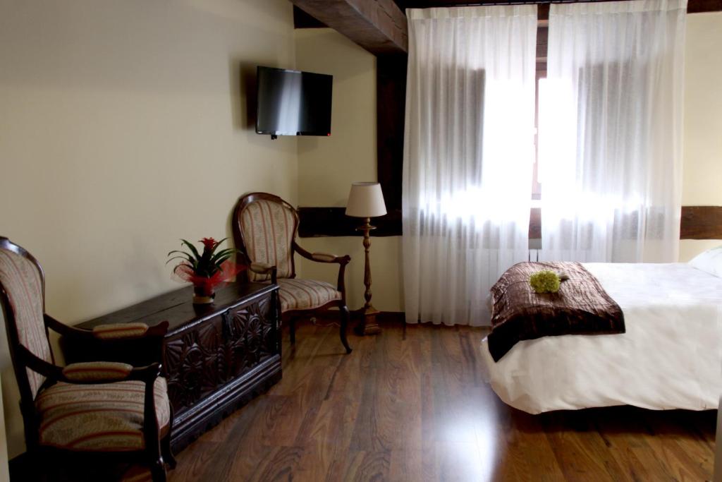Postel nebo postele na pokoji v ubytování Posada Rural La Piñorra