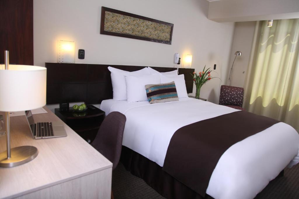 Postel nebo postele na pokoji v ubytování Hotel Rivera Inn