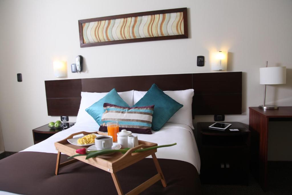 Postel nebo postele na pokoji v ubytování Hotel Rivera Inn