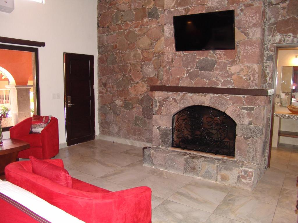 TV a/nebo společenská místnost v ubytování Hotel Casa Don Quijote