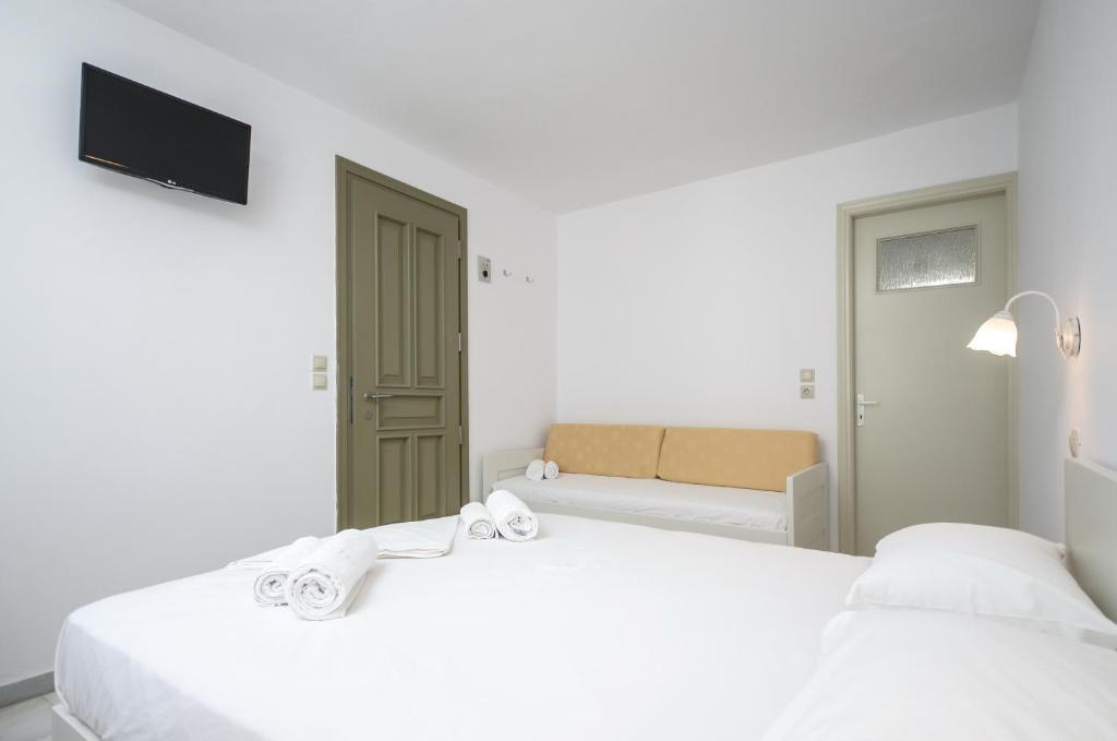 A bed or beds in a room at Soula Naxos