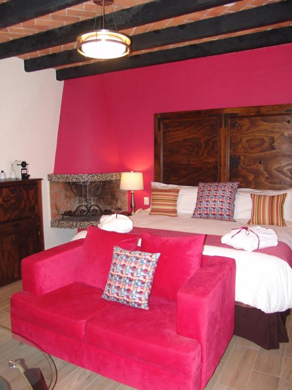 Postel nebo postele na pokoji v ubytování Hotel Casa Don Quijote