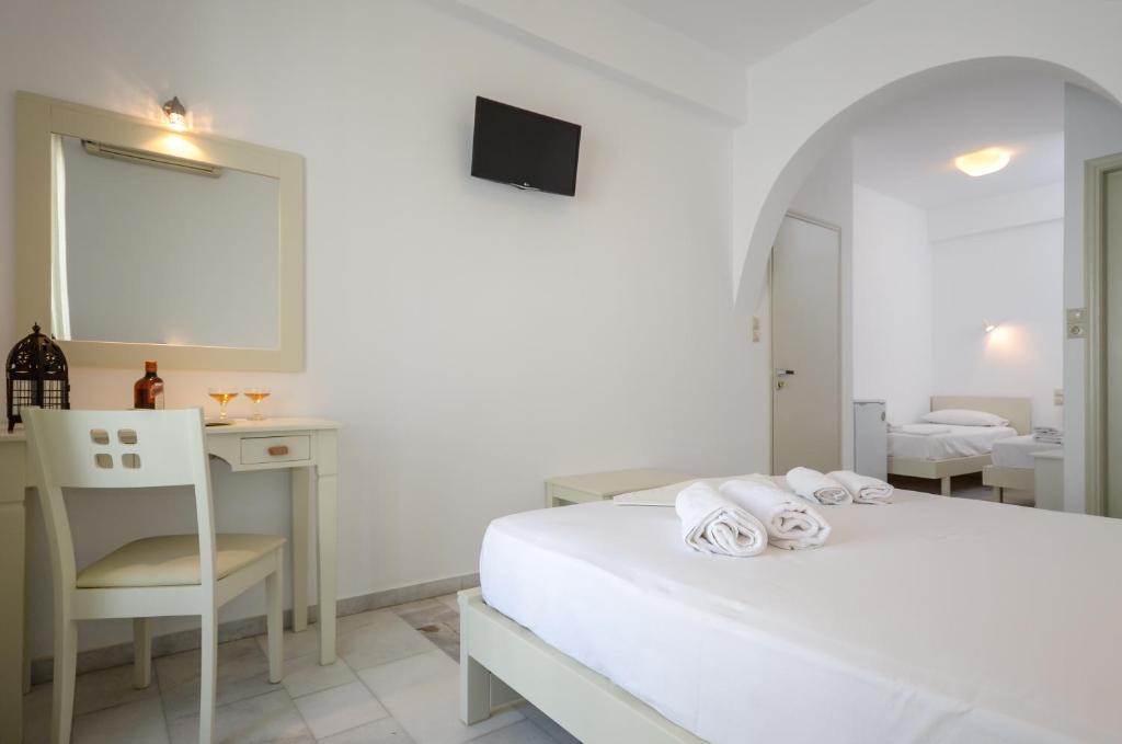 A bed or beds in a room at Soula Naxos