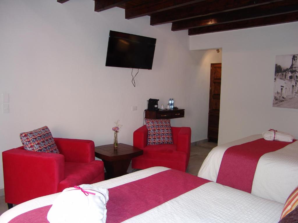 TV a/nebo společenská místnost v ubytování Hotel Casa Don Quijote