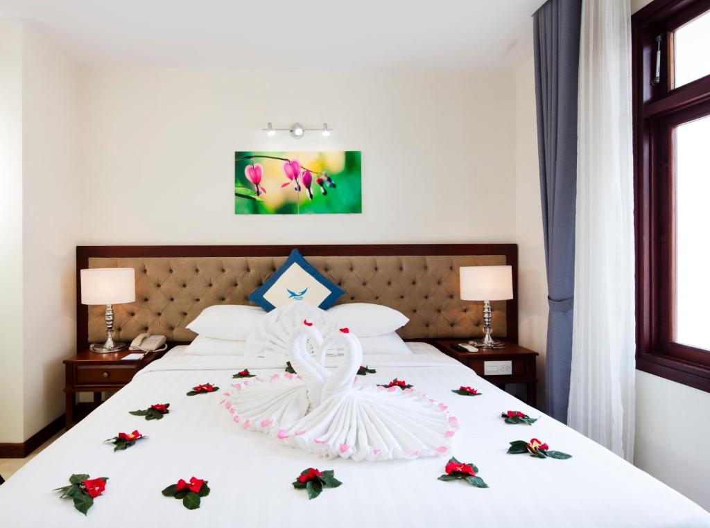 Giường trong phòng chung tại Apus Hotel