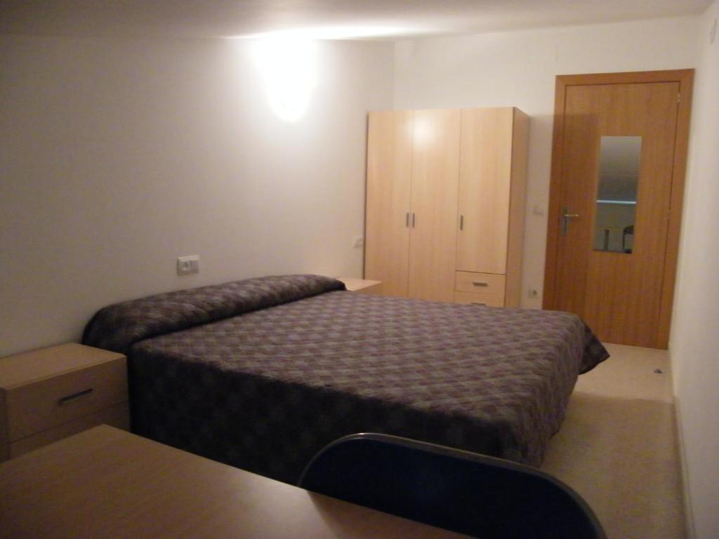 Postel nebo postele na pokoji v ubytování Amolls Restaurant i Habitacions